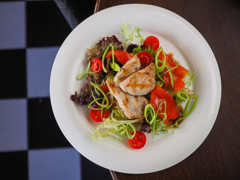 Cafe Zupas seasonal salad with grilled chicken and house dressing